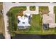 Aerial view of the property showing the house, yard, pool, and proximity to the water at 292 Long Meadow Ln, Rotonda West, FL 33947