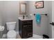 Cozy powder room featuring rustic wood vanity, black hardware and neutral walls at 292 Long Meadow Ln, Rotonda West, FL 33947
