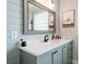 Charming bathroom with horizontal plank walls, quartz countertop and stylish mirror at 292 Long Meadow Ln, Rotonda West, FL 33947
