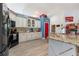 Well-equipped kitchen featuring granite countertops, ample cabinet space, modern appliances, and a convenient pantry at 292 Long Meadow Ln, Rotonda West, FL 33947