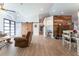 Inviting living room with an open layout, chic decor, and stylish wood-look flooring at 292 Long Meadow Ln, Rotonda West, FL 33947