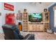 This living room features a vintage Coca-Cola theme with a decorative entertainment center and retro-style refrigerator at 292 Long Meadow Ln, Rotonda West, FL 33947
