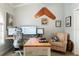 Comfortable office with large desk, office chair, and striped armchair at 292 Long Meadow Ln, Rotonda West, FL 33947