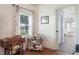 Cozy office nook filled with natural light from the window, features wood floors and doorway to bathroom at 292 Long Meadow Ln, Rotonda West, FL 33947