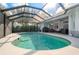 Beautiful pool area with a screened-in enclosure offering a private outdoor retreat at 292 Long Meadow Ln, Rotonda West, FL 33947