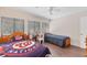 Bedroom with hardwood floors, two twin-sized beds, and an overhead ceiling fan at 3330 Thornwood Rd # 3330, Sarasota, FL 34231