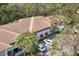 Exterior shot of condo buildings featuring ample parking, mature trees, and well-maintained landscaping at 3330 Thornwood Rd # 3330, Sarasota, FL 34231
