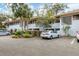 Condominium exterior with manicured landscaping, neutral paint, and assigned parking at 3330 Thornwood Rd # 3330, Sarasota, FL 34231