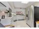 Modern white kitchen with stainless steel appliances and ample counter space at 3330 Thornwood Rd # 3330, Sarasota, FL 34231