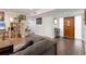 Open concept living area with hardwood floors and bright entry door creating a seamless flow at 3330 Thornwood Rd # 3330, Sarasota, FL 34231