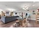 Expansive living space with dining area, living room with sectional, and views into kitchen area at 3330 Thornwood Rd # 3330, Sarasota, FL 34231