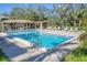 Large community pool with ladder access and plenty of lounge chairs at 3330 Thornwood Rd # 3330, Sarasota, FL 34231