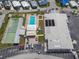 Aerial view of the community clubhouse, pool, shuffleboard courts, and parking at Tidevue Estates at 4103 12Th Street E Ct, Ellenton, FL 34222