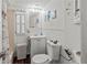 Bright bathroom with beadboard paneling, white vanity, and decorative nautical accents at 4103 12Th Street E Ct, Ellenton, FL 34222
