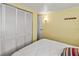 Bedroom featuring a closet and a door that leads to another space at 4103 12Th Street E Ct, Ellenton, FL 34222
