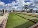 Residents enjoy a game of bocce ball at Tidevue Estates at 4103 12Th Street E Ct, Ellenton, FL 34222