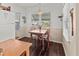 Charming dining area features a wooden table with seating for four near a window at 4103 12Th Street E Ct, Ellenton, FL 34222