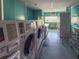 Well-equipped laundry room with multiple washers, dryers, and ample space for residents' convenience at 4103 12Th Street E Ct, Ellenton, FL 34222