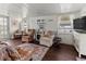 Inviting living room featuring wood floors, white walls, and charming decor and window allowing plenty of natural light at 4103 12Th Street E Ct, Ellenton, FL 34222