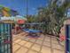 Well-maintained patio with lush landscaping, hammock, and sunshade at 4103 12Th Street E Ct, Ellenton, FL 34222