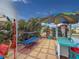 Relaxing outdoor patio space with hammock, landscaping, and shade tent at 4103 12Th Street E Ct, Ellenton, FL 34222