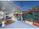 A partially covered patio area offers ample outdoor seating and beautiful landscaping at 4103 12Th Street E Ct, Ellenton, FL 34222