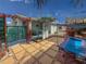 Outdoor living with an outdoor kitchen, sunshade, and a comfortable hammock for relaxation at 4103 12Th Street E Ct, Ellenton, FL 34222