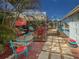 Charming patio area with vibrant decor, comfortable seating, and a relaxing outdoor ambiance at 4103 12Th Street E Ct, Ellenton, FL 34222