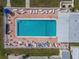 Aerial view of the fenced community pool, bordered by lounge chairs for residents at 4103 12Th Street E Ct, Ellenton, FL 34222