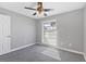 Bright bedroom featuring neutral walls, carpet, ceiling fan and sunlit window views at 4104 35Th W Ave, Bradenton, FL 34205