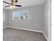 Bedroom with neutral carpet, a window with blinds, and a ceiling fan at 4104 35Th W Ave, Bradenton, FL 34205