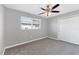 Bedroom with neutral carpet, ceiling fan, and a window with horizontal blinds at 4104 35Th W Ave, Bradenton, FL 34205
