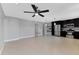 Modern kitchen with stainless steel appliances, dark cabinets, and tile flooring at 4104 35Th W Ave, Bradenton, FL 34205