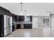 Updated kitchen featuring stainless steel appliances and sleek, dark wood cabinetry at 4104 35Th W Ave, Bradenton, FL 34205