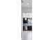 Kitchen featuring stainless steel appliances, dark cabinets, and stylish backsplash at 4104 35Th W Ave, Bradenton, FL 34205