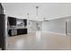 Modern kitchen featuring stainless steel appliances, dark cabinets, and updated tile backsplash at 4104 35Th W Ave, Bradenton, FL 34205