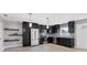 Stylish kitchen featuring dark wood cabinets, stainless steel appliances, and a contemporary design at 4104 35Th W Ave, Bradenton, FL 34205