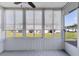 Enclosed lanai with neutral colors and an outdoor view at 4104 35Th W Ave, Bradenton, FL 34205