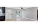 Bright living room featuring tile floors, a ceiling fan, and a front door with a window at 4104 35Th W Ave, Bradenton, FL 34205