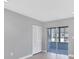 Bright room with sliding glass doors leading to an enclosed patio and a closet at 4104 35Th W Ave, Bradenton, FL 34205