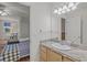 View from the granite countertop of the bathroom into the bedroom at 4117 Roberts Point Cir, Sarasota, FL 34242