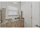 Bathroom featuring granite countertop and custom cabinetry at 4117 Roberts Point Cir, Sarasota, FL 34242