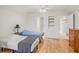 Bright bedroom with two twin beds, ceiling fan and access to the Primary bathroom at 4117 Roberts Point Cir, Sarasota, FL 34242