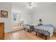 Charming bedroom features two twin beds and natural light from the window at 4117 Roberts Point Cir, Sarasota, FL 34242