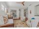 Bright living room with wood floors, ceiling fan, and stylish furnishings at 4117 Roberts Point Cir, Sarasota, FL 34242