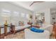 Living room featuring hardwood floors, neutral paint, and a view of the kitchen bar at 4117 Roberts Point Cir, Sarasota, FL 34242
