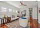 Living room featuring hardwood floors, neutral paint, and a view of the kitchen bar at 4117 Roberts Point Cir, Sarasota, FL 34242