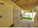 Outdoor shower with lattice walls, pebble ground covering and stepping stones leading away at 4117 Roberts Point Cir, Sarasota, FL 34242
