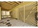 Cozy outdoor shower with pebble ground covering, lattice privacy screen and wooden overhead decking at 4117 Roberts Point Cir, Sarasota, FL 34242