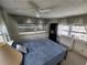 Bright bedroom with large windows, natural light and ceiling fan at 415 Dublin Ave, Bradenton, FL 34207